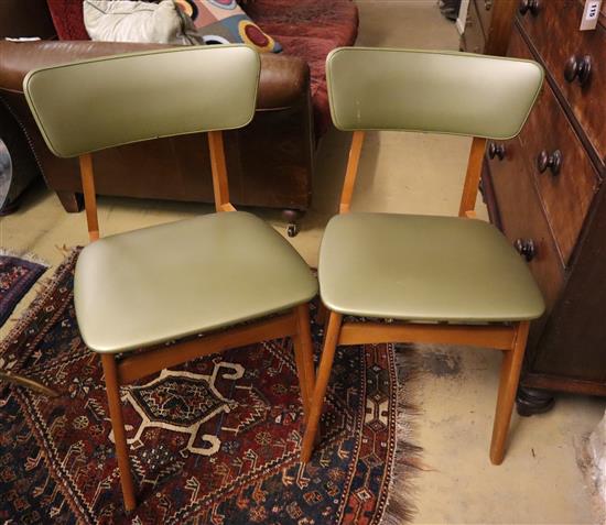 A set of four mid century dining chairs